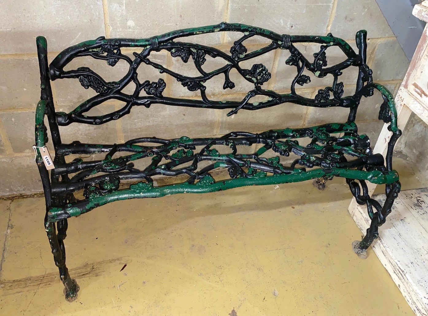 A Victorian Coalbrookdale style cast iron garden bench, length 124cm, depth 57cm, height 77cm